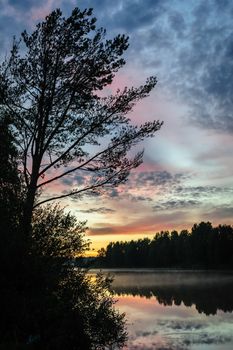 Dramatic sunset over the river in Karelia, the north of Russia