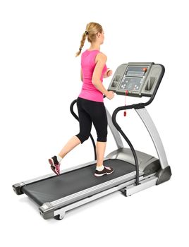 young woman doing exercises on treadmill, on white background, some blurred motion