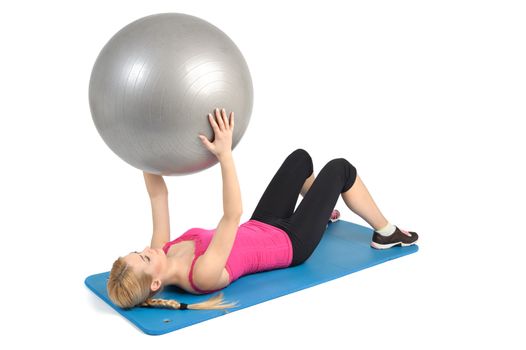 Female lying abs crunching exercise with fitness ball. position 1 of 2.