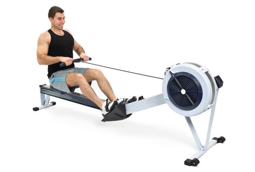 man exercising on rowing machine,  hands slightly blurred in motion