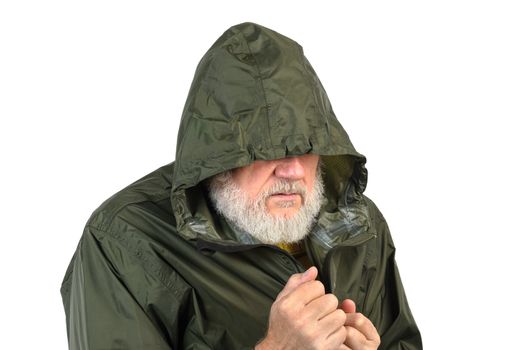 pathetic senior man in green waterproof jacket