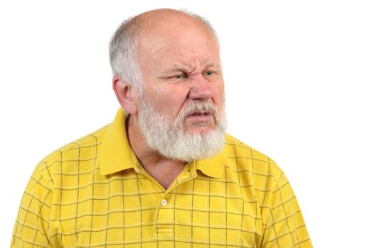 disgusted displeased senior bald man in yellow shirt
