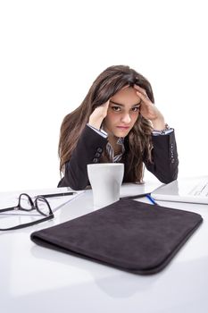 Portrait of stressed angry young business woman with hands in her head over white background