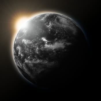 Sun over Pacific Ocean on dark planet Earth isolated on black background. Elements of this image furnished by NASA.