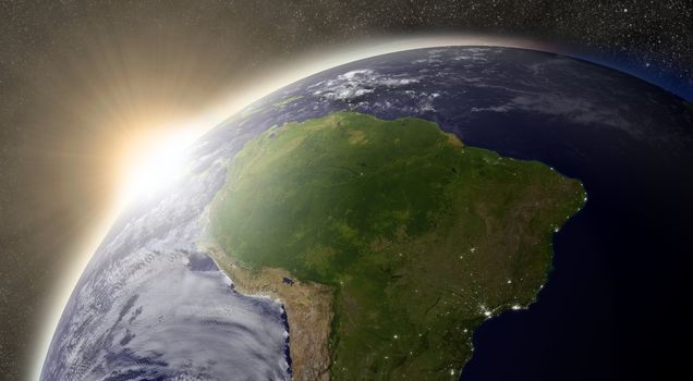 Sunset over South America region on planet Earth viewed from space with Sun and stars in the background. Elements of this image furnished by NASA.