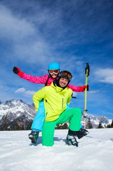 Ski, winter, snow, skiers, sun and fun - family enjoying winter vacations.