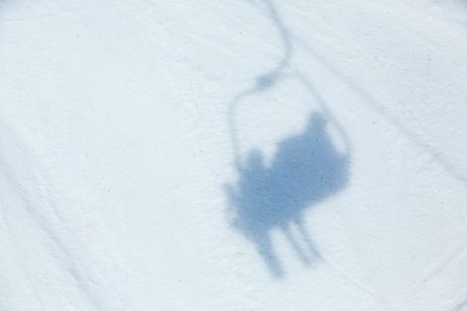 Ski lift shadow on the snow. Alps, Austria