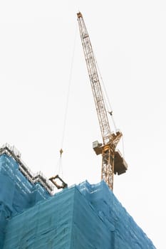 Crane on top of skyscraper