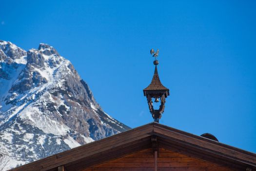 Weather-vane in the form of a cock on the roof - Austria