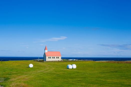 Typical Rural Icelandic Church under a blue summer sky. Horizontal shot