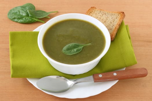 spinach soup in the white bowl