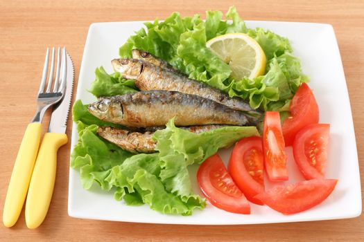fried sardines and salad
