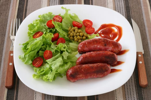 grilled sausages with salad