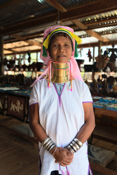 INLE LAKE, MYANMAR (BURMA) - 07 JAN 2014: Unidentified Padaung (Kayan Lahwi) tribe woman poses for a portrait. This tribe is called "long neck" because of metal rings around their necks.