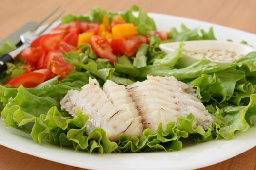boiled fish with salad