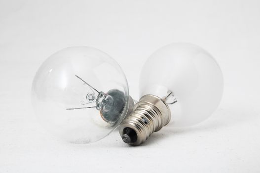 Two Different Old Incandescent Light Bulbs on a White Background
