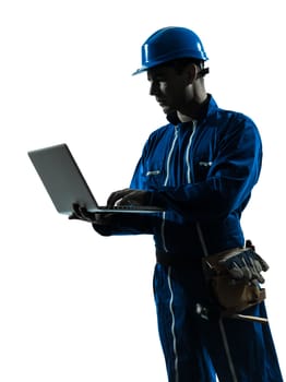 one caucasian man construction worker computing computer  silhouette portrait in studio on white background