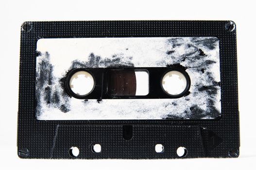 Ancient Vintage Used Musicassette over a White Background