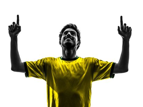 one brazilian soccer football player young man happiness joy pointing up in silhouette studio on white background