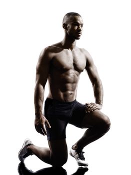 one young african muscular build man silhouette  isolated on white background