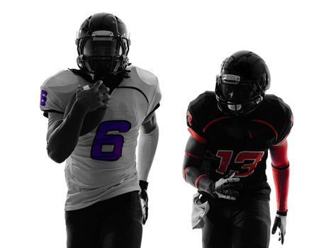 two american football players running in silhouette shadow on white background