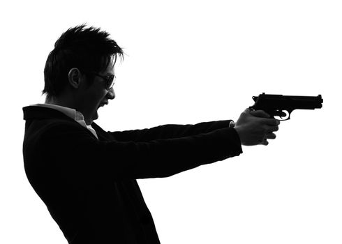 one asian gunman killer portrait  shooting in silhouette isolated white background