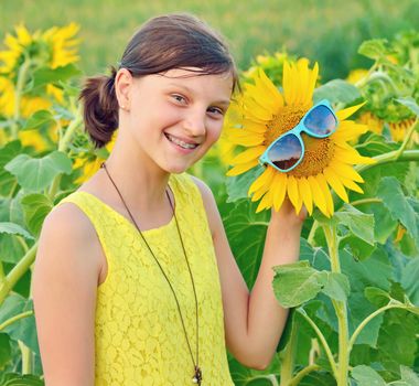 Portrait of a beautiful young Teenage on sunflower field