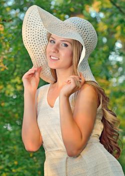 Beautiful Teenage Model girl with summer hat