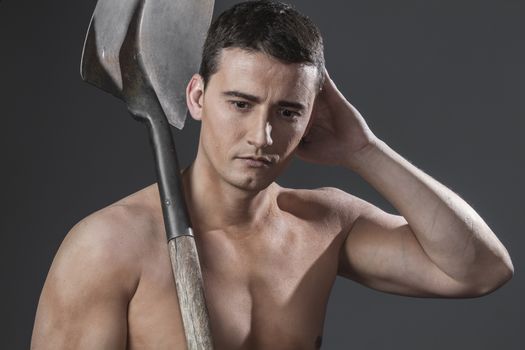 Repair, Male worker holding a shovel, sexy builder