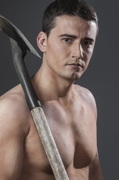 Labour, Male worker holding a shovel, sexy builder