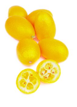 Heap of Exotic Fruit Kumquat Full Body and Two Halves isolated on white background