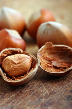 Hazelnuts, filbert on old wooden background 