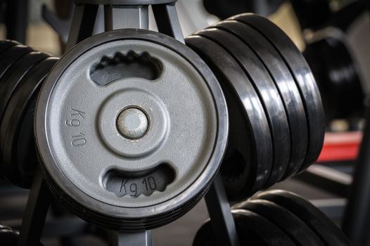 Barbell plates holder rack in the gym