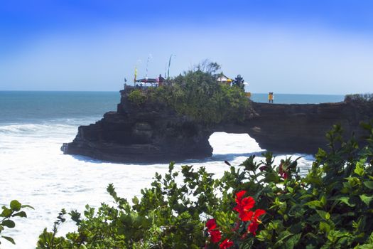 Tanah Lot and Hibiscus Flowers, Bali. Indonesia. 