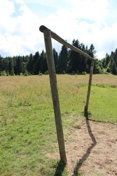 wry football gate in rural field in village