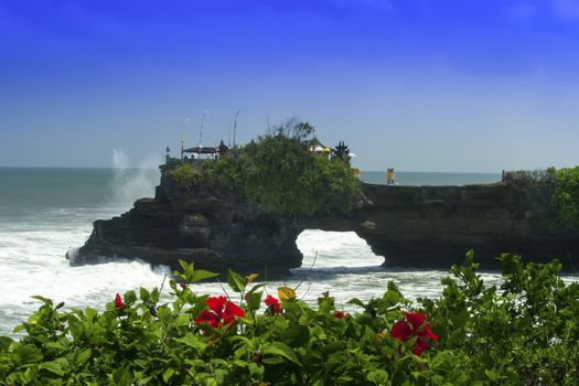 Tanah Lot and Hibiscus, Bali. Indonesia. Ocean beach.