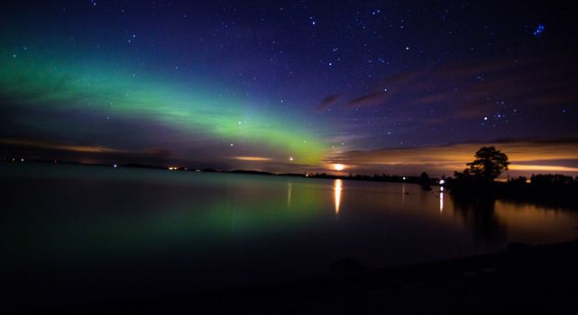 Northern Lights over the lake in Sweden