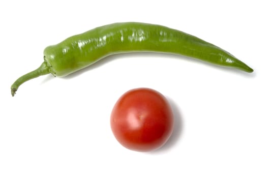 Red tamato and green pepper closeup on white background