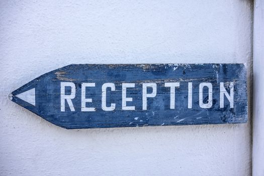 Reception Sign on white wall