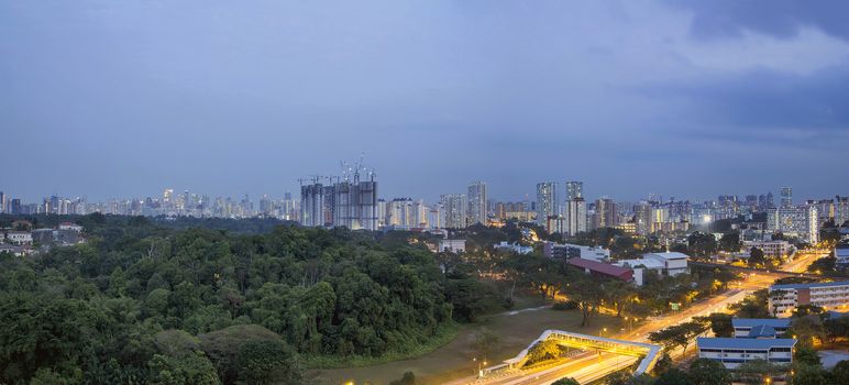 Singapore Cityscape with Housing Estate Condominiums Apartment Buildings and Central Business District in the Distant at Blue Hour Panorama

