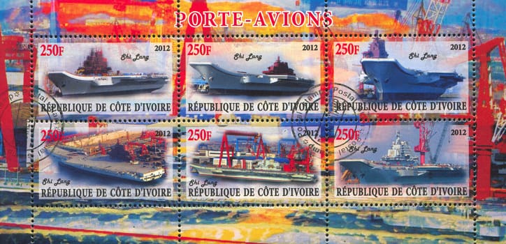 IVORY COAST CIRCA 2012: stamp printed by Ivory Coast, shows aircraft carrier, circa 2012