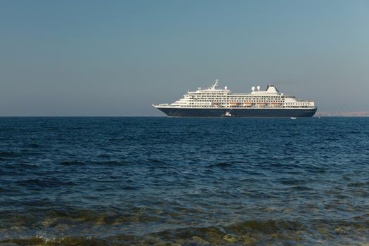 Cruiseship heading out at the sea