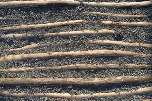 wooden timber in a gravel