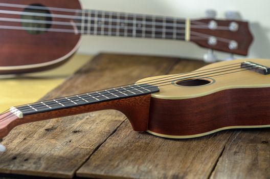 ukuleles  against a wooden background.