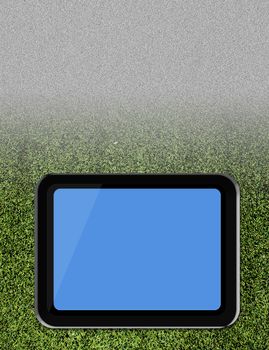 Tablet pc on soccer grass field