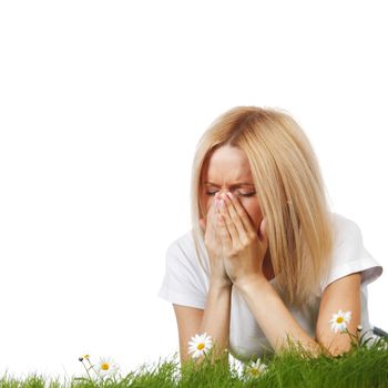 Pollen allergy, woman sneezing in a field of flowers