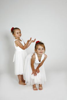 Twins in white dresses