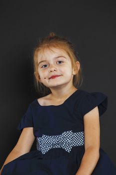 Young little woman on a black background







Lady