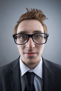 Portrait of young Nerd businessman looking at camera