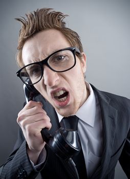 Angry nerd businessman retro telephone call shouting